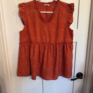Sleeveless V-Neck Peplum Tunic in Rust Dot